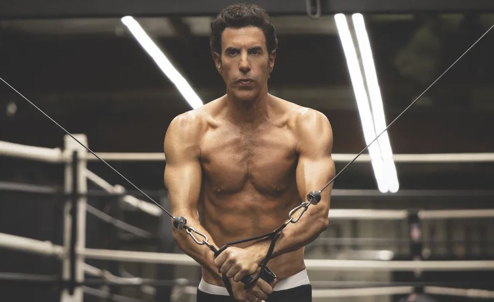 Είναι ΑΙ, αυτοσαρκασμός ή ειλικρίνεια; Oι λαδωμένοι κοιλιακοί του Σάσα Μπάρον Κοέν συζητιούνται